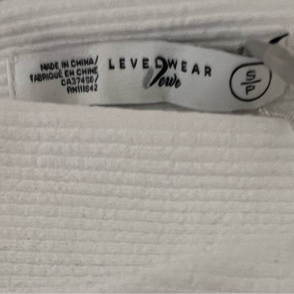 Women’s Level Wear white shirt. Verve Kandi, off shoulder